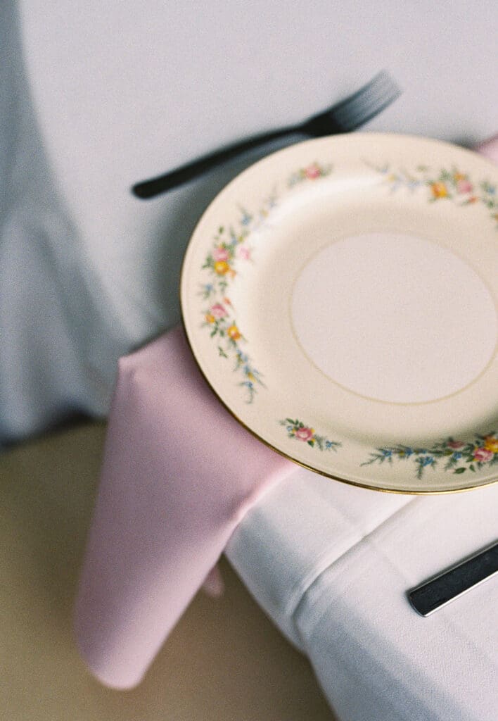 film vs digital wedding photography. dainty china plate detail photos of wedding reception photographed on film in knoxville. 