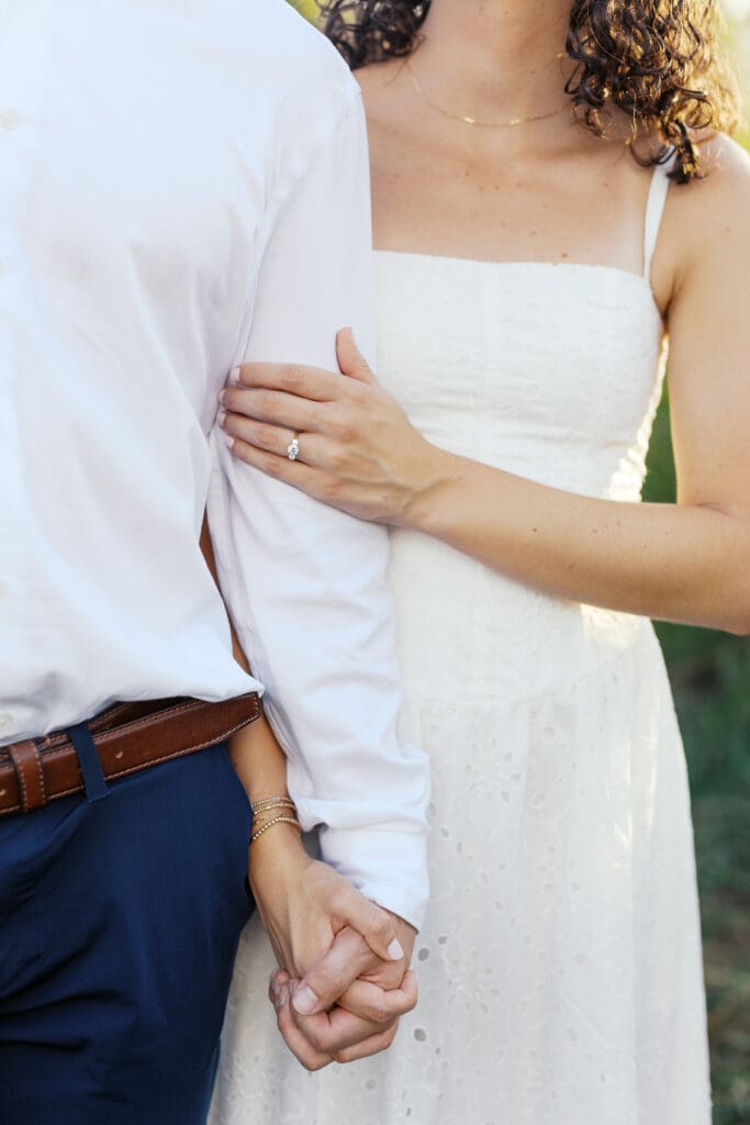 engagement photo outfit with neutral tones and flowy dress