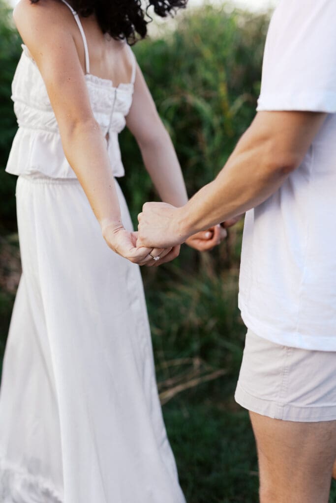 couple holding hands during engagement photos in Johnson City Tennessee
