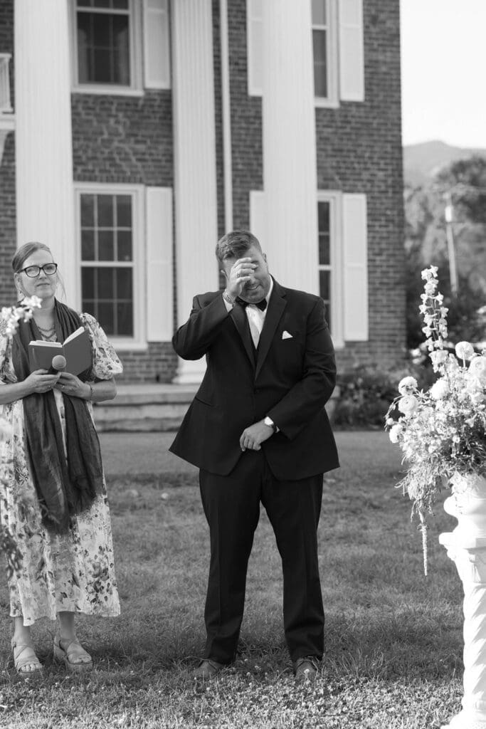 Groom wiping tears from eyes during ceremony knoxville tn wedding