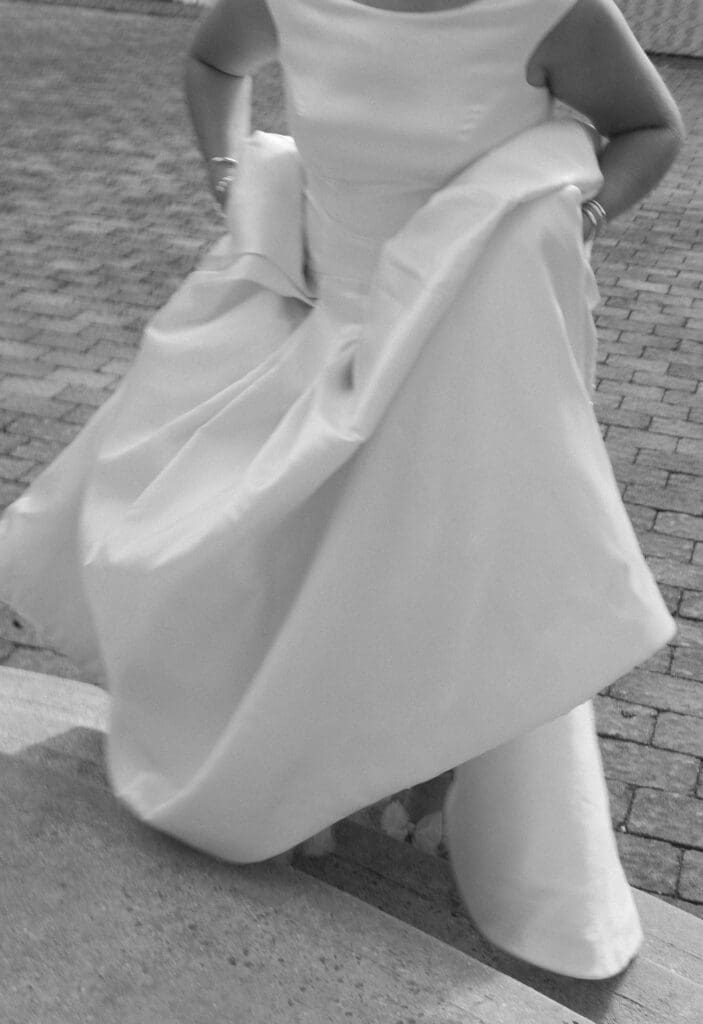 editorial image of bride holding her dress on her wedding day in knoxville tn 