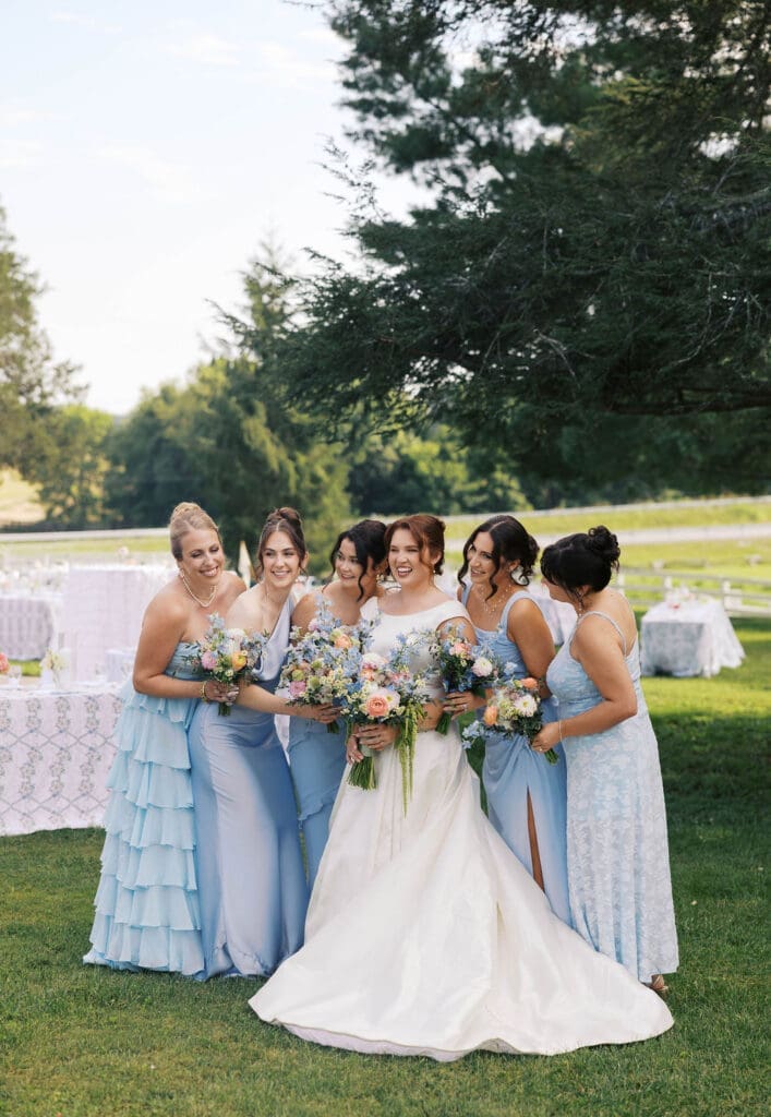 candid moment of bride with her bridesmaids smiling and laughing knoxvillw tn wedding